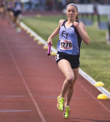Senior Emily Bracher runs the relay
