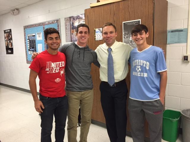 Mr. Briggs with soccer captains (from left) Jake Kennis, Mike Maltese, and Mark Fasano
