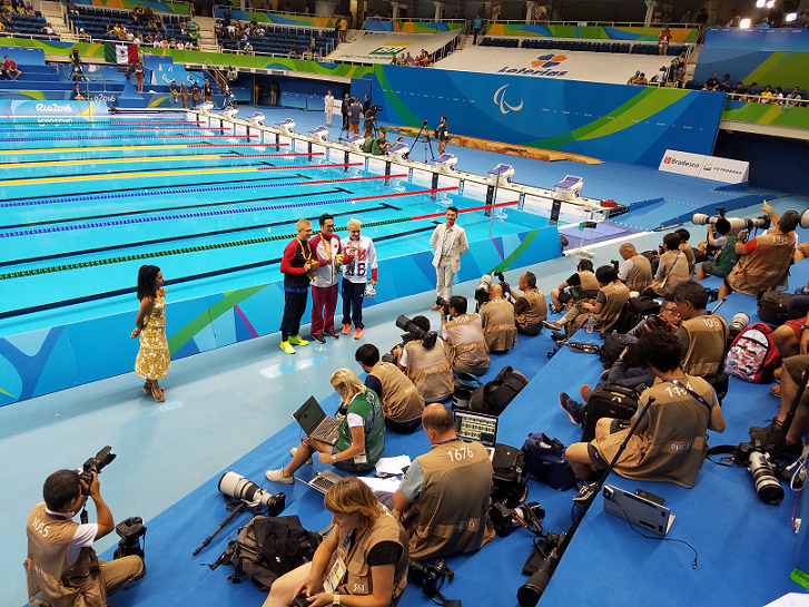The medal ceremony was covered by reporters from all over the world