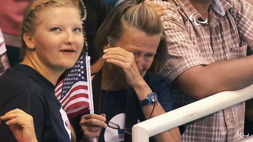 Molly and her mom as they watch Robert win the bronze