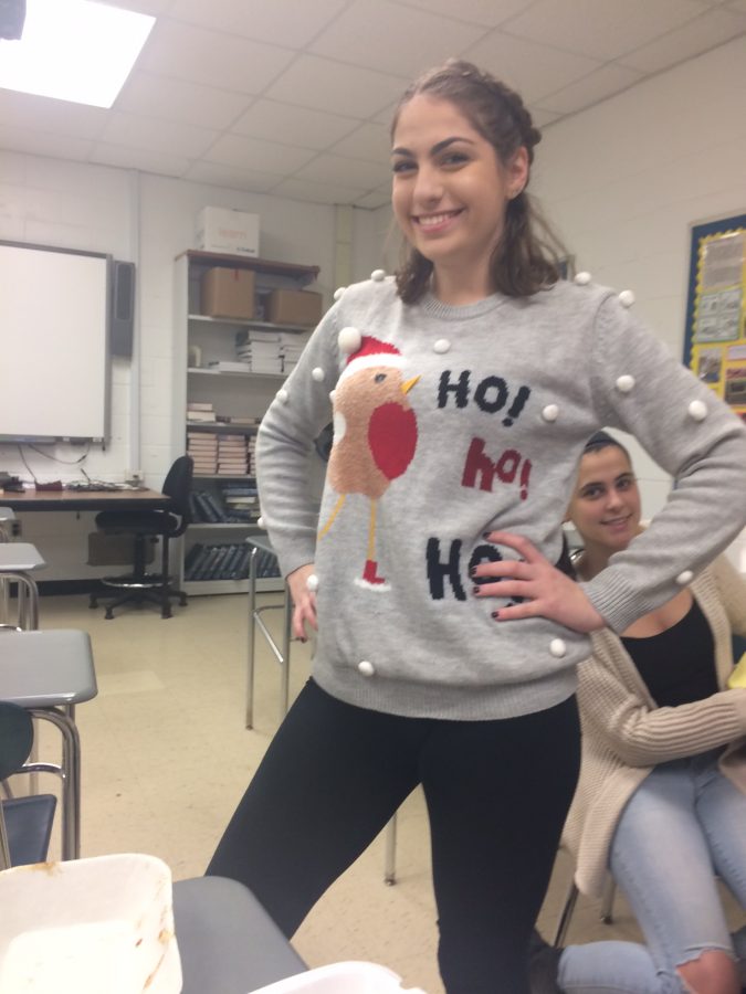 Senior+Leah+Emmerich+shows+off+her+very+fashionable+Christmas+chicken+sweater%2C+complete+with+snowballs