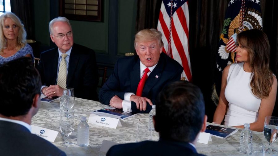 President Trump with Former US Secretary of Health and Human Services Tom Price (left) and First Lady Melania Trump (right), discussing opioid abuse in a briefing in Bedminster, New Jersey. 
